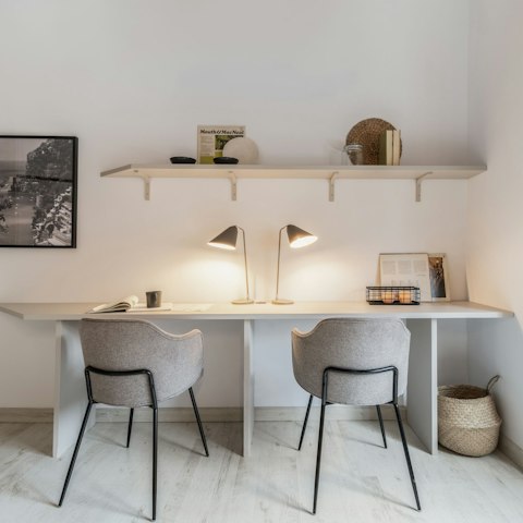 Catch up on emails at the double desk area