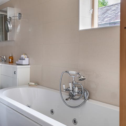 Sit back and relax in the bubbles of the whirlpool bathtub