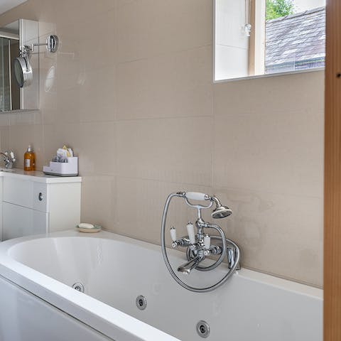 Sit back and relax in the bubbles of the whirlpool bathtub