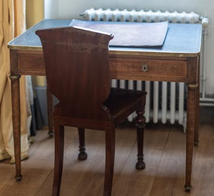 Get some work done at the antique desk overlooking the Seine