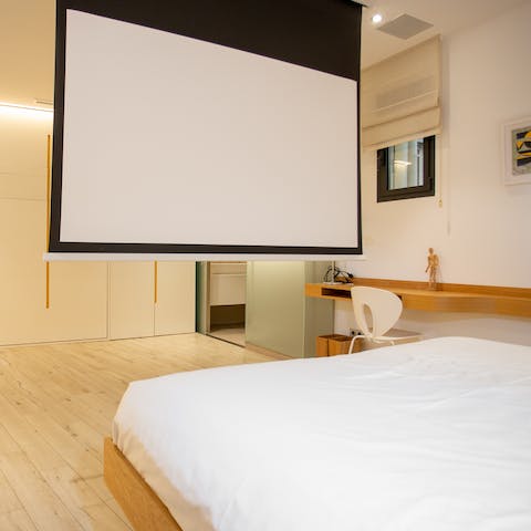 Relax with a movie screened on the home projector
