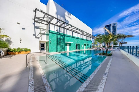Swim above the Miami skyline on a clear blue day