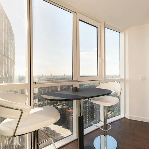 Sit at the bar in the enclosed sun room, and admire the view