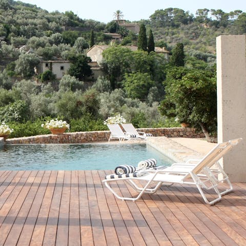 Laze by the pool and admire the mountain views