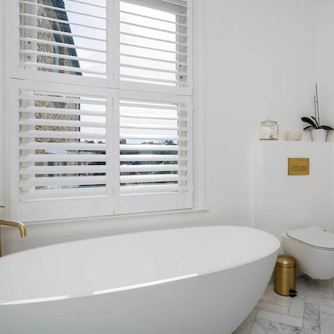 Treat yourself to an uninterrupted soak in the freestanding bathtub