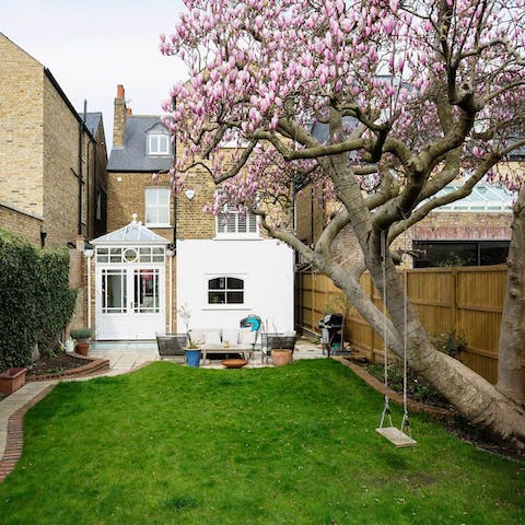 Swing on the magnolia tree or lounge on the patio with the barbecue smoking away