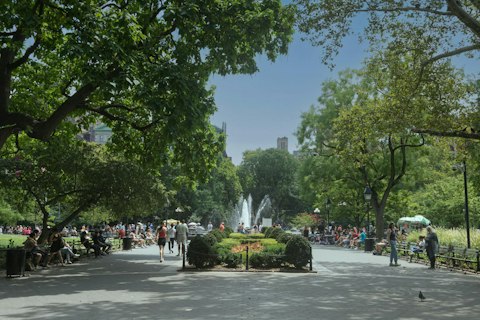 Unwind in Washington Square Park, Greenwich Village's iconic sun-drenched centrepiece