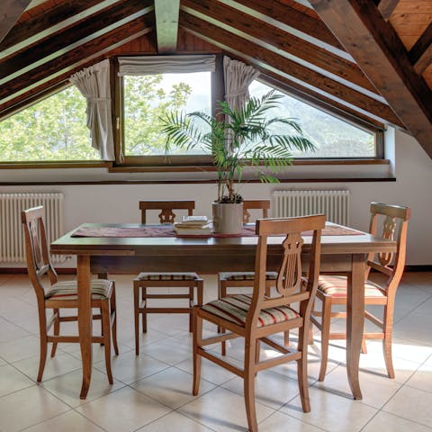 Gather around the dining table to feast on a local pizza takeaway