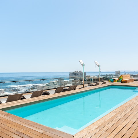 Take a dip in the communal rooftop swimming pool, and admire the views