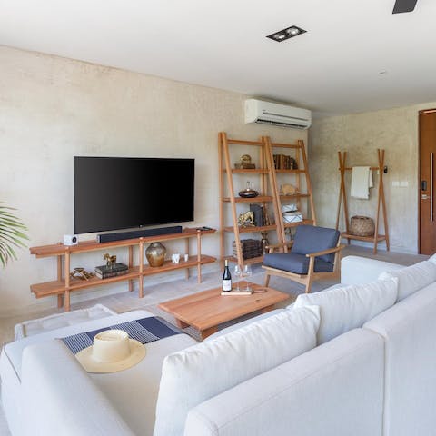 Snuggle up for an evening of movies in the stylish living room