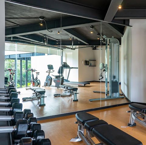 Stay on top of your fitness goals with a workout in the communal gym