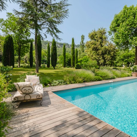Lounge by the edge of the private swimming pool
