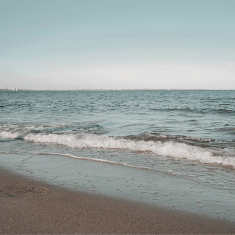 Take an eight-minute drive to sink your feet into the sand at Spathi beach