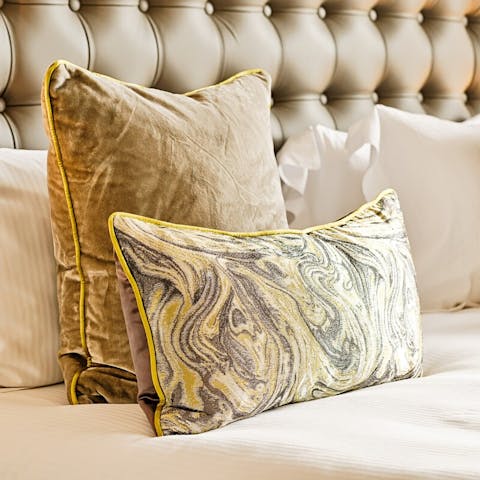 Sink into your superior quality bed and rest your head on plump pillows