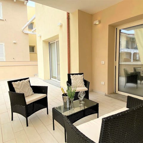 Wind down with a glass of Italian wine on the private terrace