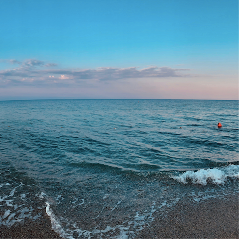 Cool off in the crisp waters of Spiaggia Longa, 300 metres away