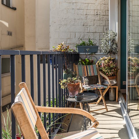 Unwind with a glass of wine on your sun-kissed balcony