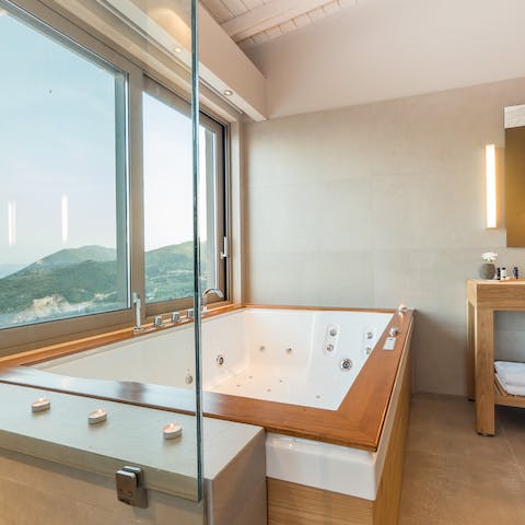 Watch the sunset whilst soaking in the luxurious bath