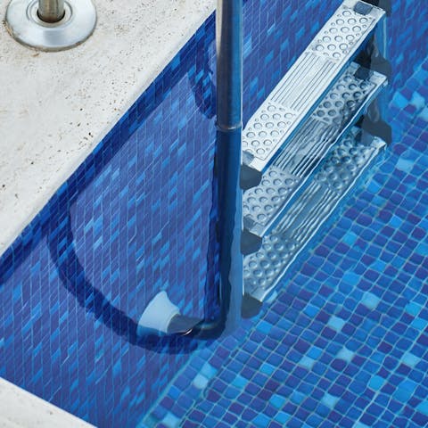 Take a refreshing dip in the building's shared outdoor pool