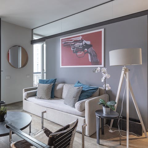 Relax in the contemporary living space with a spritz and antipasto platter