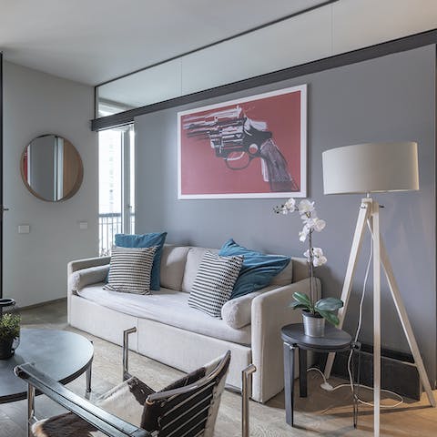 Relax in the contemporary living space with a spritz and antipasto platter