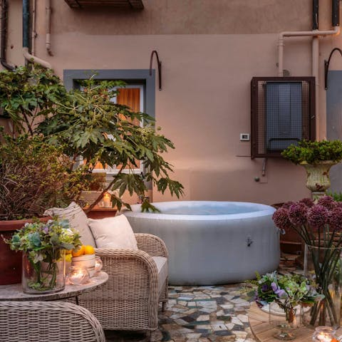 Unwind with a glass of wine in the Jacuzzi hot tub