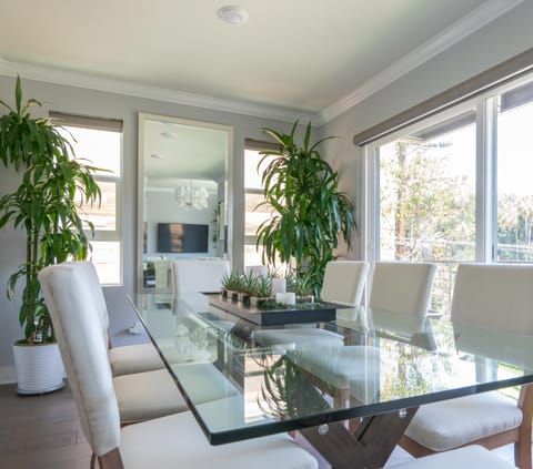 Entertain at the dining table surrounded by lush plants