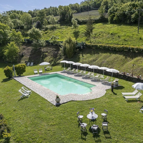 Experience total relaxation while lounging by the shared pool