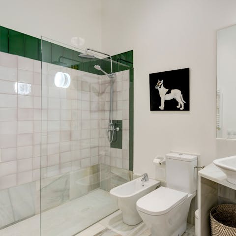 Start mornings with a relaxing soak under the bathroom's rainfall shower