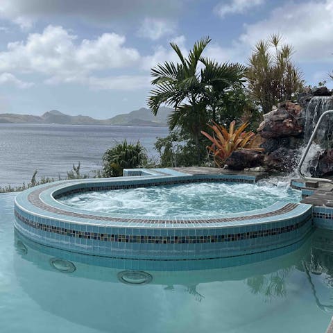 Take a relaxing soak in the private Jacuzzi, overlooking the water