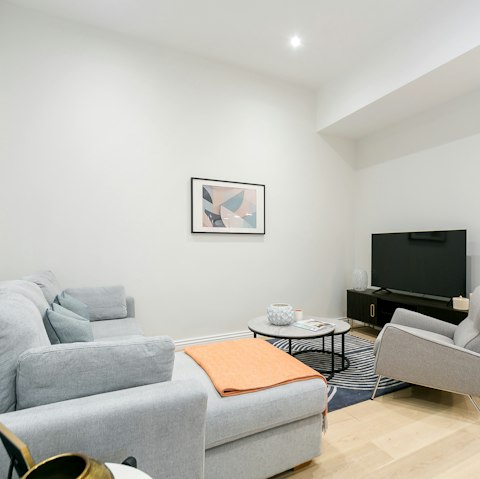 Enjoy a film in the light and bright living room