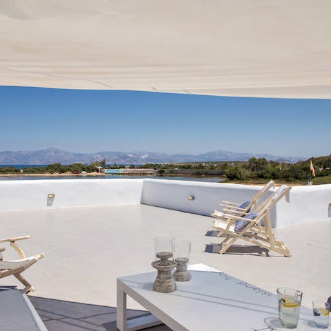 Take in the picturesque Cyclade island views while sunbathing on the terrace