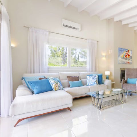 Sprawl out on the white leather sofa for an afternoon siesta