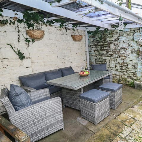 Dine alfresco during the warmer months in the enclosed garden