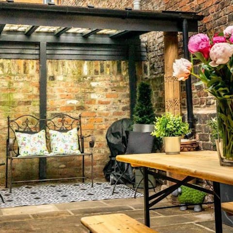 While away an evening in the gorgeous garden with a glass of something bubbly