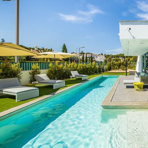 Jump into the sparkling swimming pool to cool off