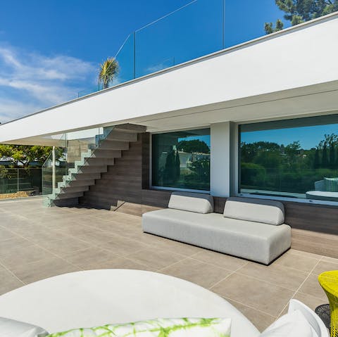 Chill out with a cool drink on the sleek terrace