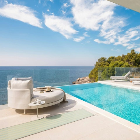 Kick back by the infinity pool and admire the coastal views