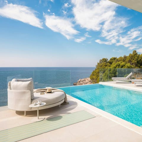 Kick back by the infinity pool and admire the coastal views