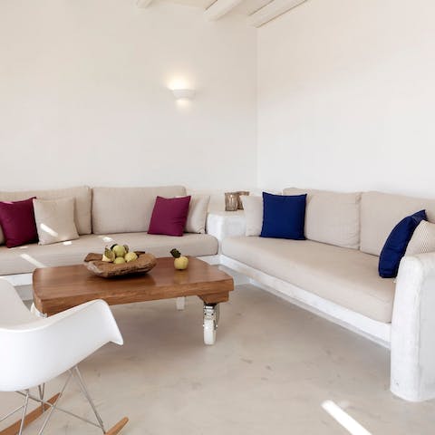 Let the group spread out with three separate living rooms to choose from