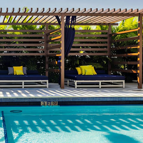 Stretch out in a poolside cabana