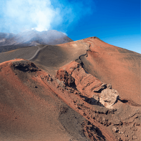 Join a tour of majestic Mount Etna, just thirty minutes away