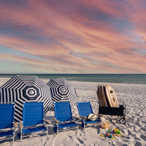 Soak up the sun on the white sand beach outside your door