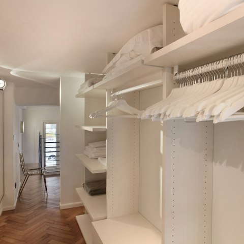 Store all your purchases from this fashion capital in the large walk-in wardrobe