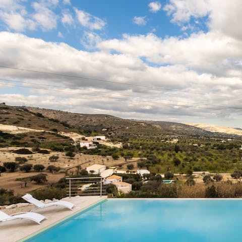Head down to the shared pool for a refreshing dip, overlooking the captivating countryside scenery