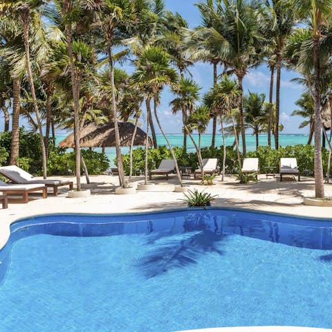 Spend dreamy days lounging by the private pool