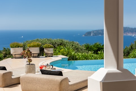 Unwind poolside with panoramic Mediterranean views towards Cap Ferrat