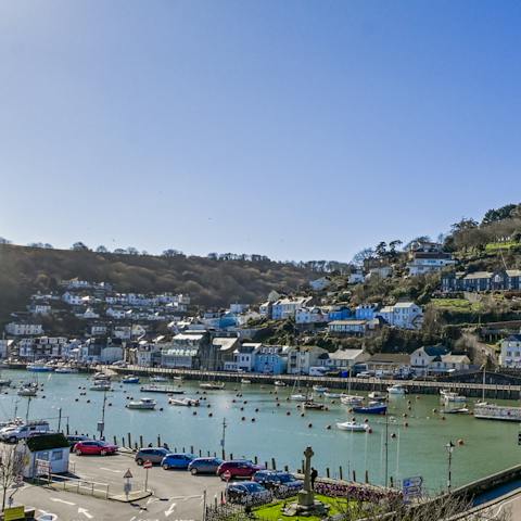 Breathe in the fresh air on the private balcony, watching the boats bob on the river