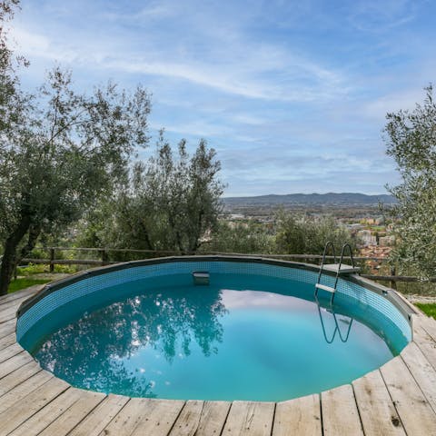 Enjoy countryside views from the shared swimming pool