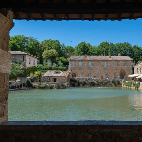 Take a therapeutic dip in the hot springs of Bagno Vignoni, a fifteen-minute drive away
